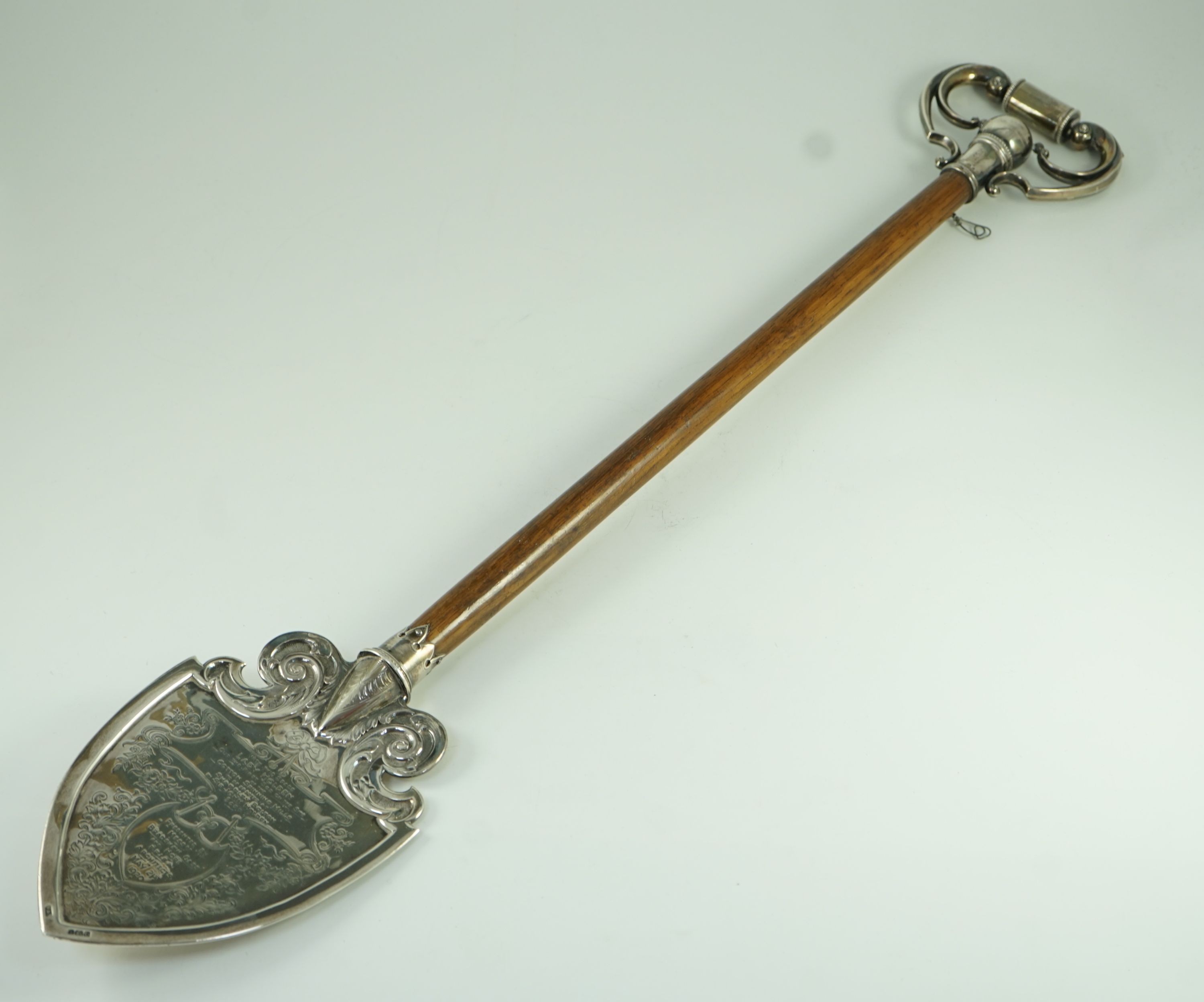 A large George V silver mounted oak presentation spade, by Vaughton & Sons